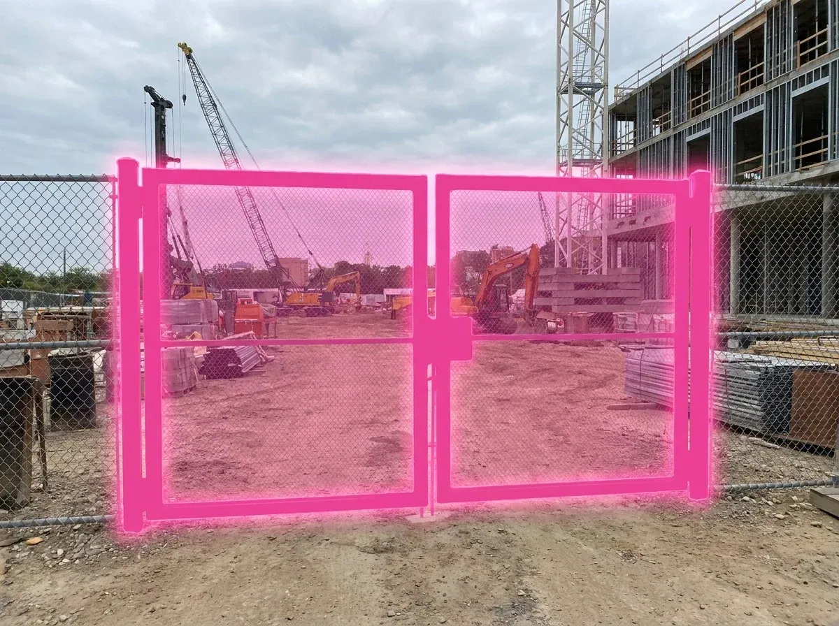 AI segmentation mask over a construction site entrance gate on a construction site